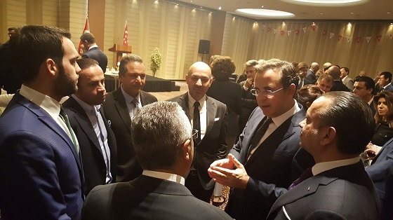 Honorary Consul-General Murat Özyeğin speaking with guests at the reception