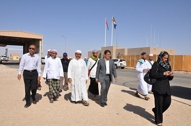 The evacuated Singaporeans are accompanied by Dr Albakri Ahmad, Dean of MUIS Academy (left, in sunglasses) and Richard Grosse, Consul-General of the Singapore Consulate-General in Muscat and leader of the Crisis Response Team (in grey suit). [Photo credit: MFA]